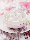 Quark cream with meringues in a bowl