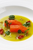 Marinated organic salmon in a stinging nettle broth