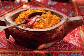 Spices in a carved wooden bowl