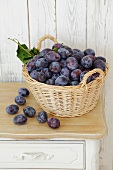 Fresh plums in a basket