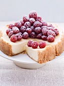 Cheesecake with fresh raspberries, sliced