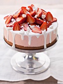 Strawberry ice cream cake on a cake stand