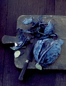 Red cabbage, sliced on a chopping board