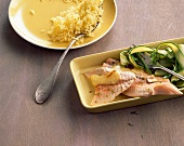 Poached char with spring vegetables and rice