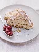 Ice cream stollen with chocolate, brittle and cherry compote