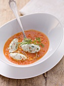 Tomato soup with cheese and herb dumplings