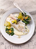 Cod fillet with mustard gherkins, spinach and dill sauce