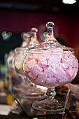 Marshmallows in glass jars on a counter