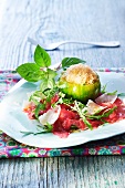Carpaccio with grated Parmesan with a green tomato filled with sorbet