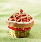 A cupcake decorated to look like a pie