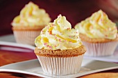 Cupcakes with yellow frosting and sugar sprinkles