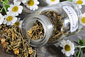 Dried feverfew in an apothecary bottle
