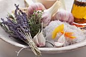 An arrangement of lavender, thyme, garlic and coarse salt