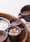 Cocoa being poured into cups