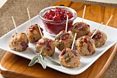 Turkey Sage Meatballs with Toothpicks; On a Platter with Dipping Sauce