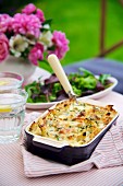 Penne with ham and cheese, baked in the oven