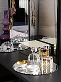 Perfume and jewellery box on dressing table in bedroom