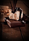 Chocolate Sauce Pouring Over a Homemade Marshmallow on a Square of Chocolate