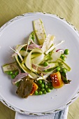 Asparagus strips with peas, onions and gnocchi