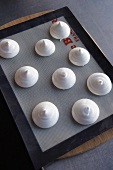 Meringues on a baking tray