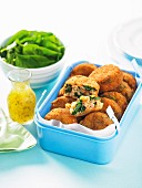 Tuna fish and rice cakes in a box for a picnic