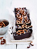 Chocolate cakes decorated with salted pretzels