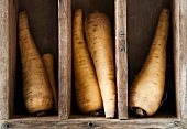 Parsnips in a wooden crate