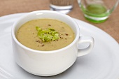 A Cup of Cream of Asparagus Soup with Cracked Pepper