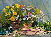 A basket of various herbs and flowers