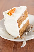A slice of carrot cake with cream cheese frosting (USA)