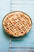 Whole Strawberry Pie on Rustic Background
