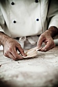 A chef making a tortellino