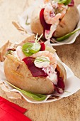 Baked potatoes with beetroot and prawns