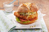 Schnitzel roll with lettuce, tomato and edible shoots