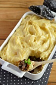 Duck casserole topped with mashed potatoes