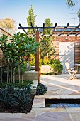 Terrace with sandstone pavers and water feature