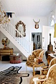 Foyer in English country-house-style with collection of traditional and bizarre accessories