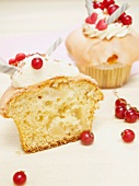 Cupcakes with an apple filling, garnished with redcurrants