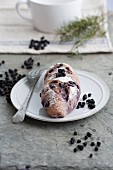 A bread roll with dried blueberries