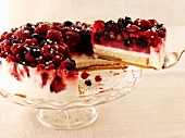 Cheesecake with berries, a piece removed