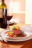 Sirloin of beef with sauté potatoes, onion rings and rosemary