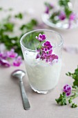 Coconut drink with scented geranium oil & pelargonium flowers