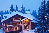 Alpine hotel in twilit winter landscape