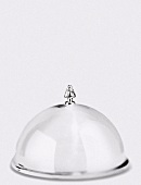 A silver cloche topped with a miniature tree