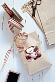 A gift bag of raspberries coated in meringue