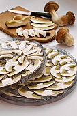 Sliced porcini mushrooms laid out to dry