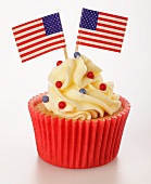 A cupcake decorated with US flags