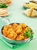 Chicken korma with samosas and naan bread (India)