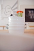 Dishes and plates stacked on table