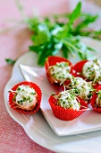 Cream cheese balls with rocket and cress